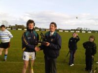 Ruairí receives his skills winner award from Leo Heatley